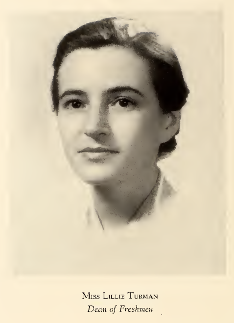 A black and white picture of Miss Lillie Turman, Dean of Freshmen. The image only depicts her from the neck up. Her hair is pulled back and the collar of her shirt is visible. 