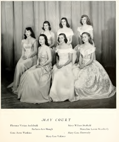 A black an white image of the 1948 May Court. It shows seven women in various dresses sitting.