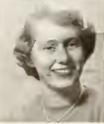 A black and white image of Phyllis Nash. She has short hair that ends around her ears and is wearing a necklace. The top of the image is a little distorted.